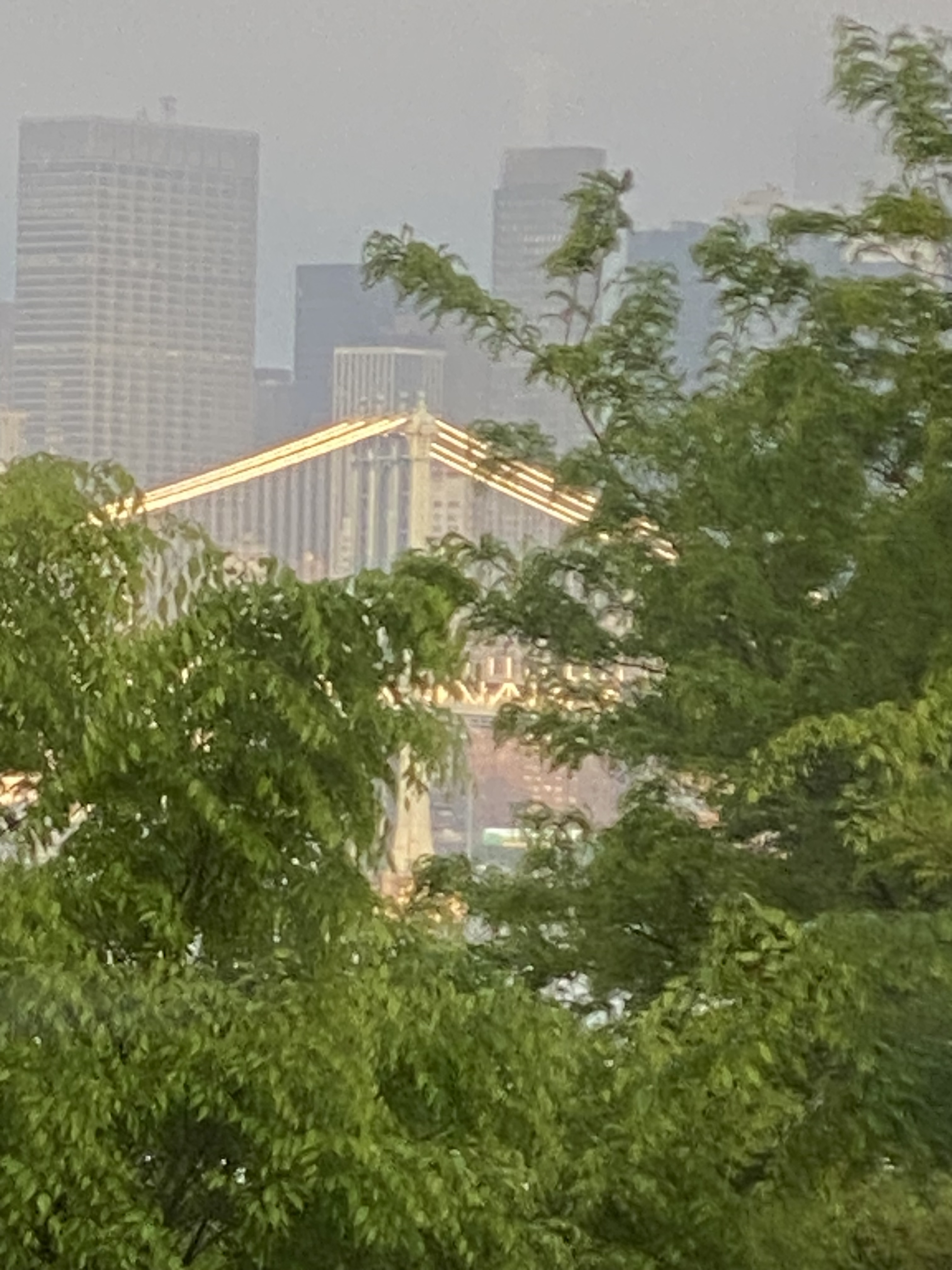 A Glitzy Shining Manhattan-Bridge from within the mist and clouds